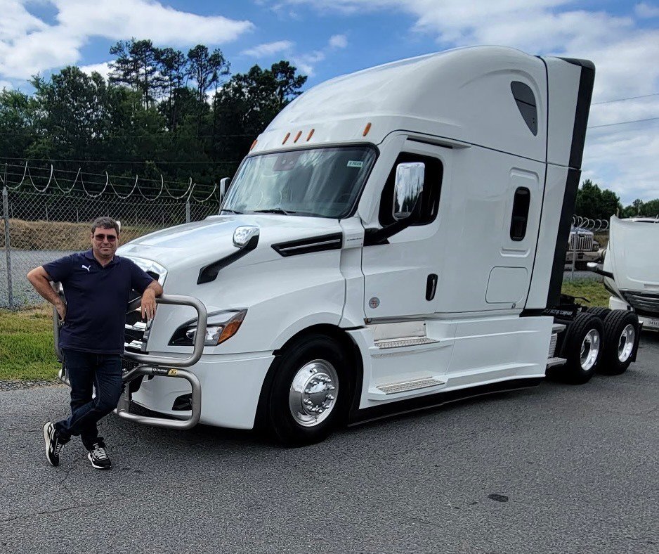 NMV Expedition driver standing with a 2023 Freightliner Cascadia in Pineville, NC