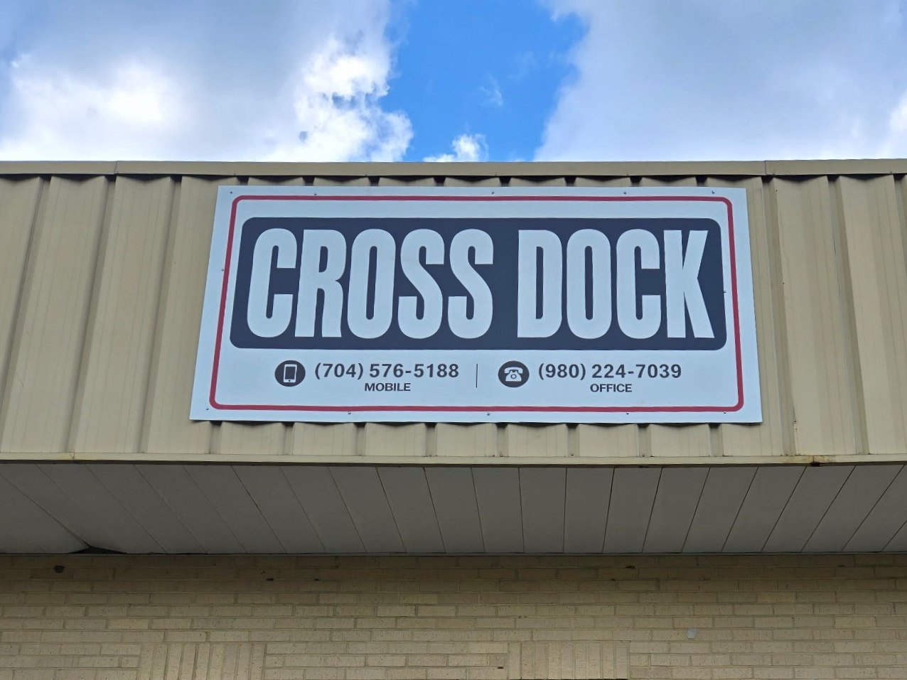 Cross Dock sign with phone number (704) 576-5188 on the Cross Dock at NMV building, 10020 Industrial Drive, Pineville, NC