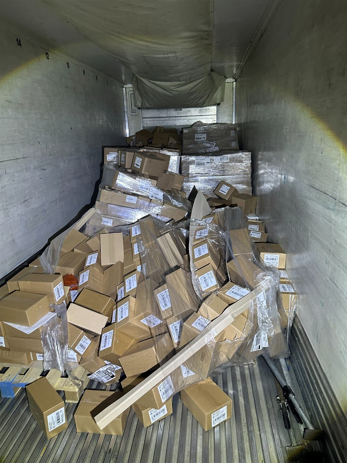 Refused load with collapsed boxes inside a trailer before pallet rework at NMV Expedition in Pineville, NC