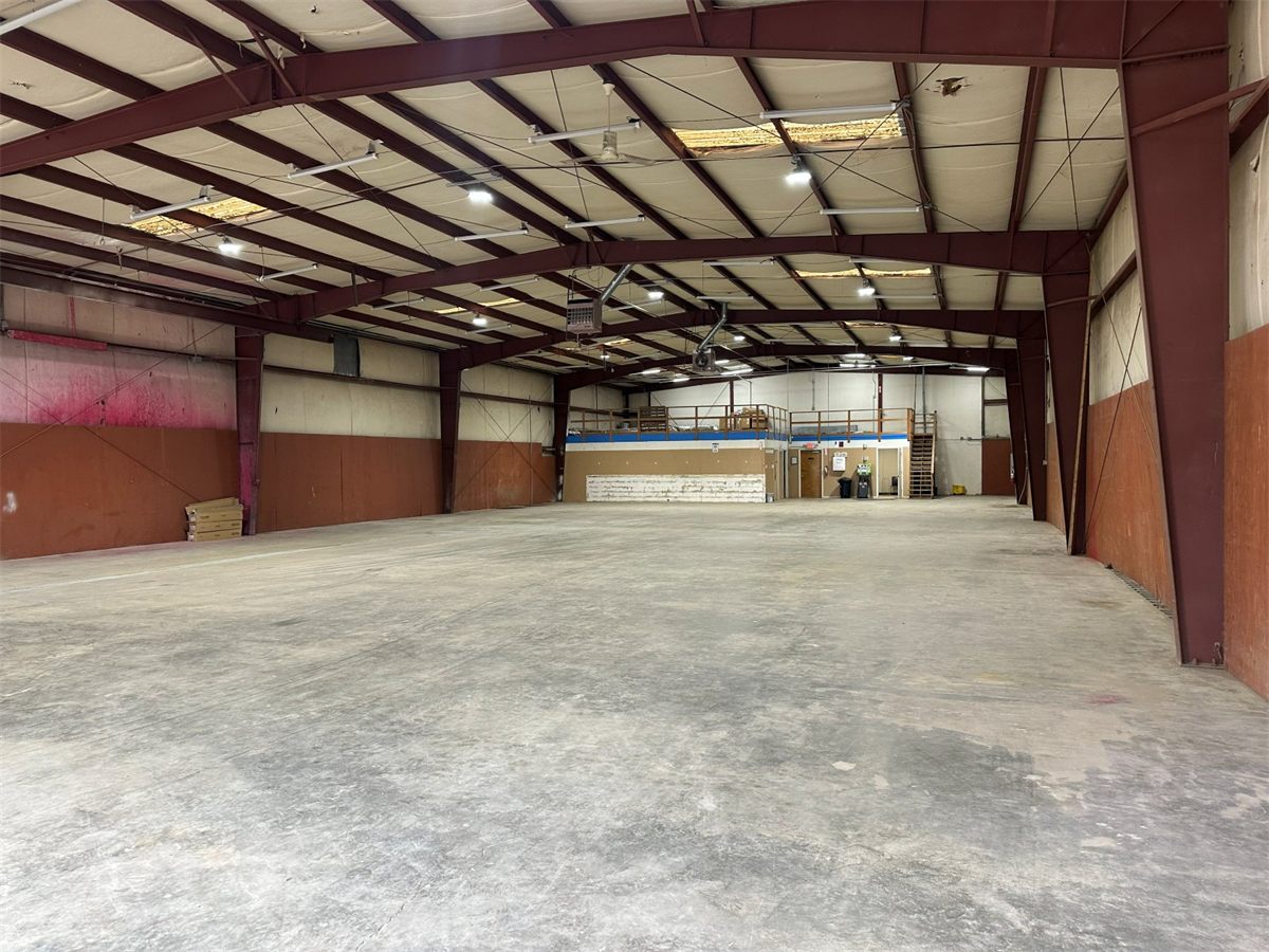 Open floor space inside the NMV Expedition warehouse